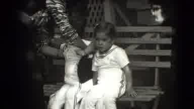 Levittown New York (1942): Black And White Film Of Mother Placing Two Young