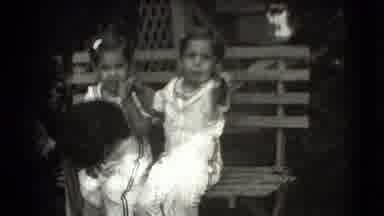 Levittown New York (1942): Two Little Girls In White Outfits Sit Together On A
