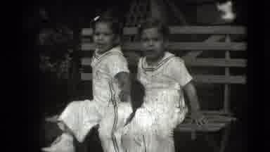Levittown New York (1942): Two Young Twin Girls Wearing Identical White Outfits