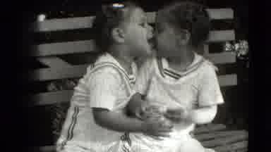 Levittown New York (1942): Twin Girls Share Sisterly Moments On A Park Bench In