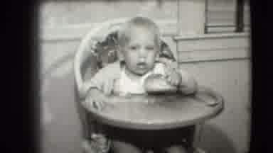 Levittown New York (1942): This Video Shows A Child In A High Chair Eating