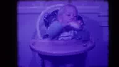 Levittown New York (1942): Baby Reaches Up And Grabs A Small Loaf Of Bread And
