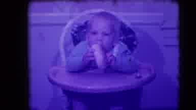 Levittown New York (1942): Baby Sitting In High Chair Playing With Loaf Of Bread