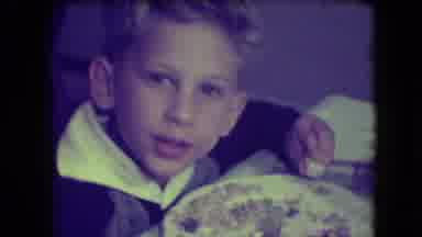 Patterson New Jersey (1946): Little Boy Talks To Camera As He Eats And Points At