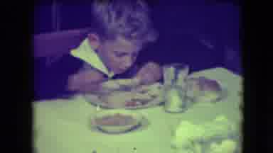 Patterson New Jersey (1946): A Boy Sitting On Dining Table Is Eating Dinner With