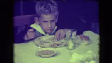 Patterson New Jersey (1946): Young Boy With Blonde Hair At A Table Eating Off A