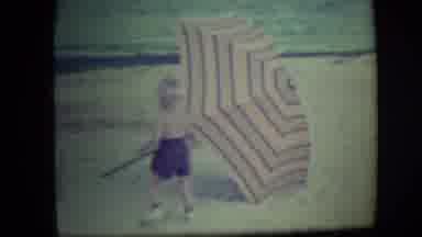 Long Beach New York (1946): A Young Blonde Boy Plays With An Umbrella At The Beach