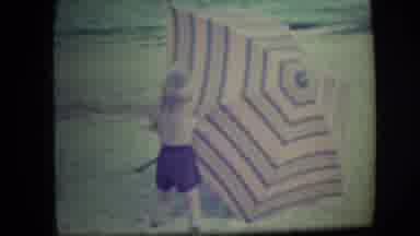 Long Beach New York (1946): Young Boy Playing With Umbrella On Sandy Beach In The