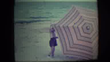 Long Beach New York (1946): A Baby Girl In A Green Field Playing With A Big