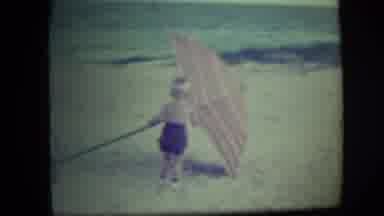 Long Beach New York (1946): A Boy At The Beach On A Windy Day Blew Down Umbrella