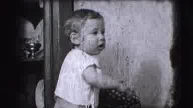 Cliffside Park New Jersey (1942): Small Baby Standing Backwards In Its Highchair