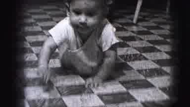 Cliffside Park New Jersey (1942): Baby Crawls Forward Across Black And White Tiled