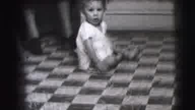 Cliffside Park New Jersey (1942): A Baby And Crawling On The Checkered Floor Of