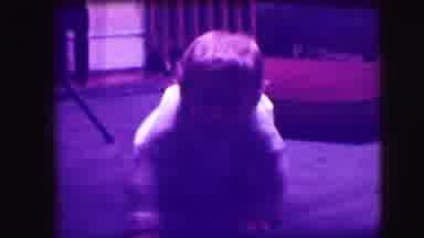 Cliffside Park New Jersey (1942): A Little Child Is Sitting In A Blue Comfy Chair