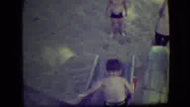 Cliffside Park New Jersey (1946): Boy Sliding Into The Sand Towards Brother While