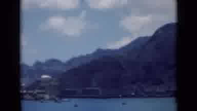 Aden Yemen (1946): An Expansive View Of A Body Of Water With Large Mountains In