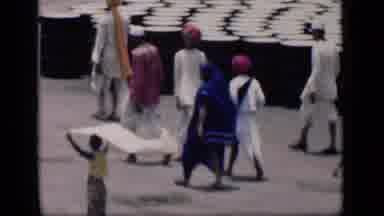 Bombay India (1946): Woman Carrying White Clothe Through Crowd