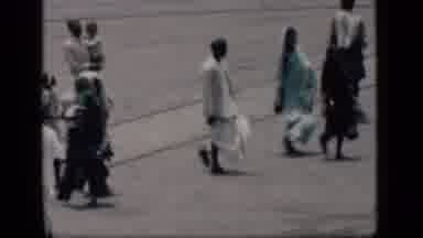 Bombay India (1946): South Asian People Walking Across Road On A Windy Day
