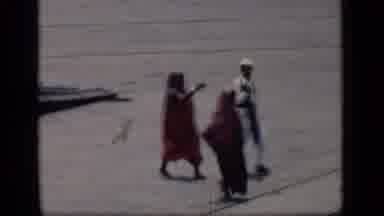 Bombay India (1946): Small Group Of People Walking On Airport Tarmac On A Bright