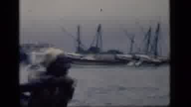 Bombay India (1946): A Man Rowing A Small Row Boat Towards A Harbor Of Big Boats