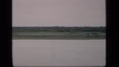 Bombay India (1946): View Of Black And White Boat Green Tree And Field On A Cloudy