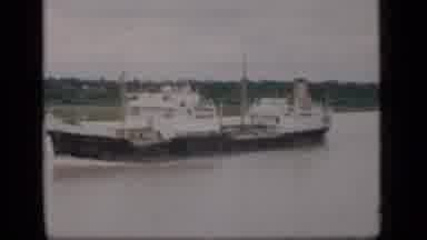 Bombay India (1946): A Boat Filmed From The Shore And Three People Walking By On