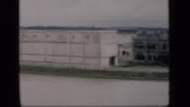 Bombay India (1946): Camera Pans Over Large White Rectangular Building