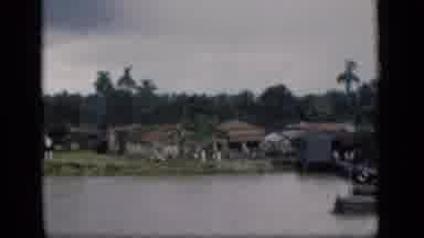 Bombay India (1946): A Pier With Boats And Houses On The Edge Of A Lake Of Calm