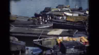 Bombay India (1946): View Of Wooden Boats And Grey Building On A Cloudy Day