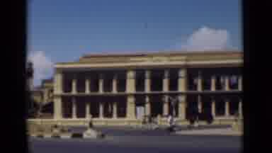 Colombo Ceylon (1946): Vintage Street Car Driving Past Antique Buildings While
