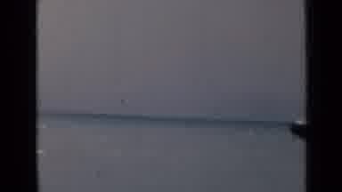 India-1946: Large Aircraft Carrier Over Calm Blue Sea And Cloudy Sky
