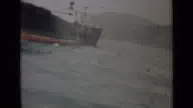 India (1946): Man Throwing Object Off A Big Ship From A Long Time Ago Followed By