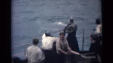 India (1946): A Bunch Of Men Are Out On The Shore Pulling A Boat