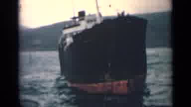 India (1946): A Large Shipping Vessel Rocks Back And Forth In The Calm Ripples Of