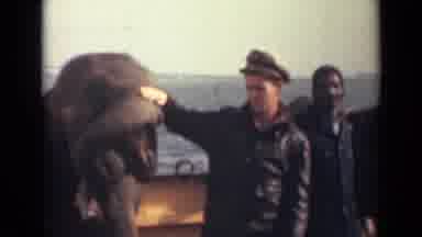 India (1946): Man Pets The Happy Elephant Before Sitting On Its Back