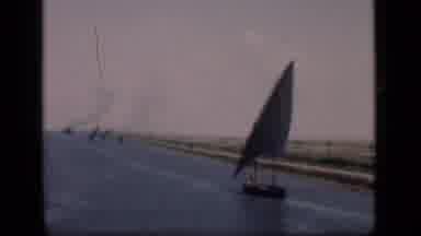 Suez Canal Egypt (1946): View Of Person Riding In Blue Sailboat On A Clear Day