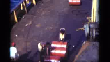 Suez Canal Egypt (1946): Men Rolling Large Red Barrel Across The Deck Of A Ship