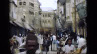 Suez Canal Egypt (1946): View Of People Surrounded By Tall Buildings In A Market