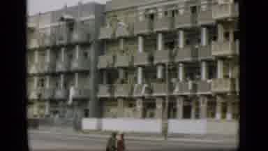 Suez Canal Egypt (1946): Couple Walking In Front Of A Flats In The City