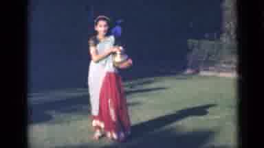 India (1947): Girl With Typical Dress From Somewhere With Something In Hand In A