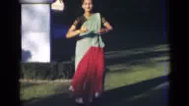 India (1947): Beautiful Indian Woman Dressed In A Sari Dancing Outside