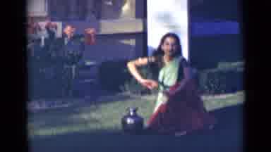 India (1947): Indian Girl Dancing In A Red And Green Sari In Her Garden Next To A