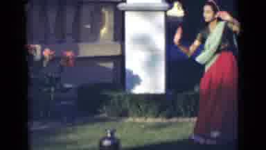 India (1947): Indian Punjabi Woman Dancing Twirl Red Dress Outside Hands Up