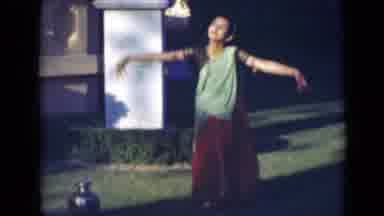India (1947): A Woman Red And Blue Dress Is Dancing In Garden