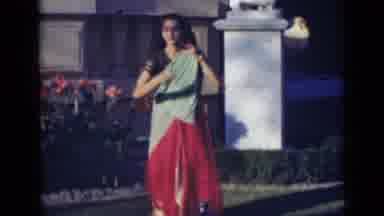 India (1947): Traditional Indian Woman Dancing While Wearing Traditional Indian
