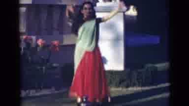 India (1947): Eastern Indian Woman In Red And Light Green Sari Picking Up Vase