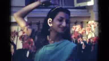 India (1947): Young Indian Girl Dancing In Backyard On Lawn At Family Party