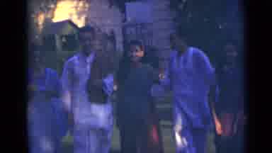 India (1947): A Group Of Male And Female Indians Walk Past Together And Then Stand