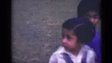 India (1947): Two Young Girls Outside One Blowing A Kiss In Grass