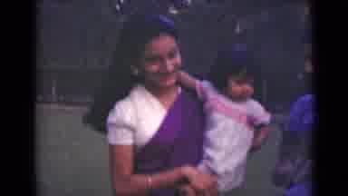 India (1947): An Indian Mother Holds Her Young Toddler Daughter On Her Shoulder